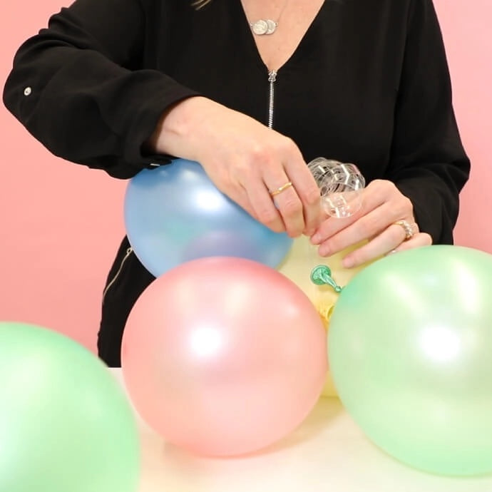 Inflated balloons joined together with balloon garland tape