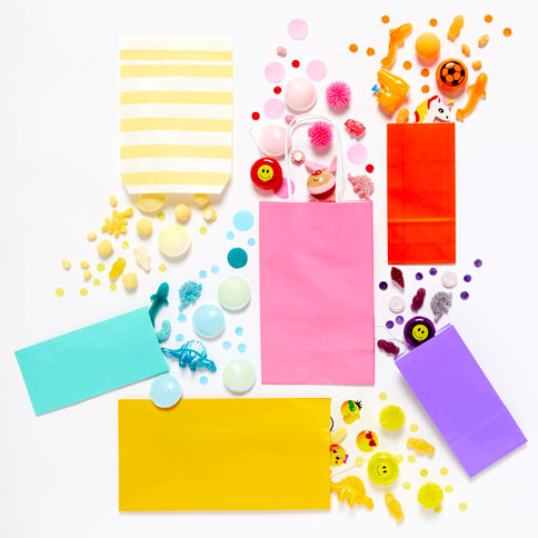 Colourful party bags and small treats arranged ready for party guests.