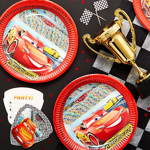 Disney cars party supplies arranged in a styled party setting.