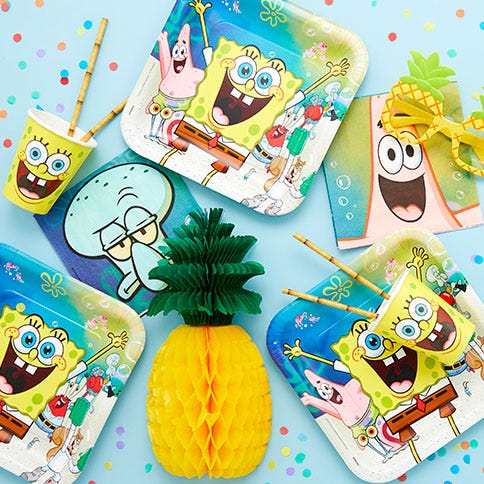 Spongebob party supplies arranged in a styled party setting.