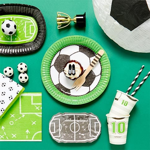 Football party supplies arranged in a styled party setting.