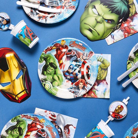 Avengers party supplies arranged in a styled party setting.