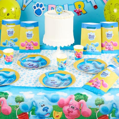 Blues clues you party supplies arranged in a styled party setting.