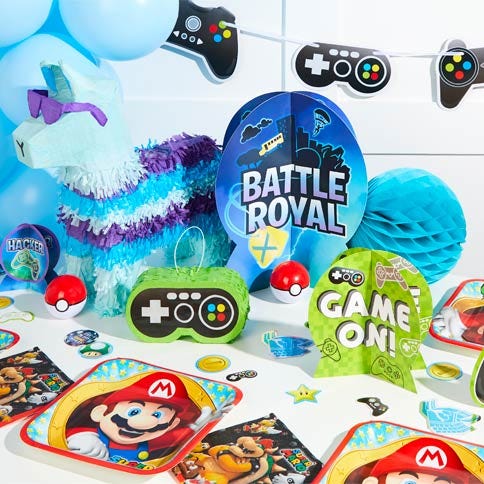Gaming party supplies arranged in a styled party setting.