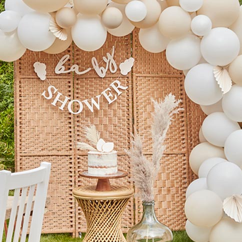 Hello baby party supplies arranged in a styled party setting.