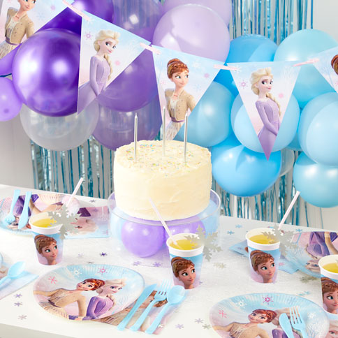 Disney frozen party supplies arranged in a styled party setting.