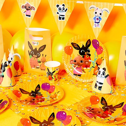 Bing bunny party supplies arranged in a styled party setting.