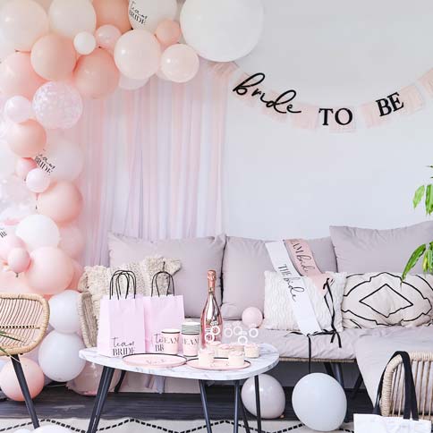 A pink hen party table styled with Future Mrs tableware and accessories.