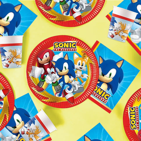 Sonic the Hedgehog party plates, cups and napkins on a yellow background.