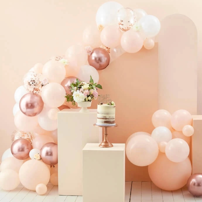 Peach and rose balloon display mixing colours and finishes
