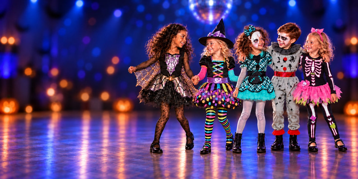 Five children at a blue-lit school Halloween disco in Iridescent Spider Girl, Miss Matched Witch, Dark Doll, Bad Clown Boy and Fancy Bones Skeleton costumes, with the boy standing with his arms over the shoulders of the girls beside him.