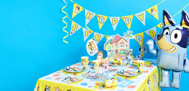 A birthday party styled with Bluey tableware and decorations.