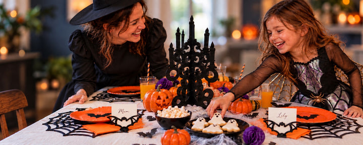 A Halloween party entrance styled with pumpkins, cobwebs and spooky decorations.