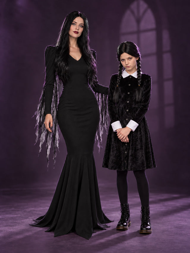Styled studio scene showing costumes from The Addams Family range.