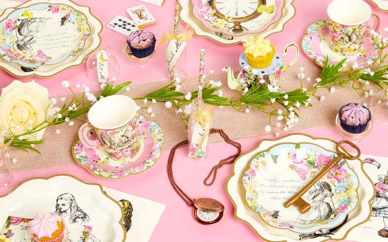12 Creative Alice in Wonderland Party Games Alice in Wonderland tea party table with themed tableware
