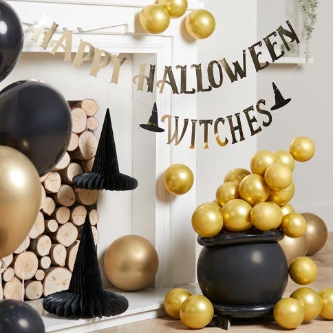 halloween decoration with cauldron and balloons as bubbles